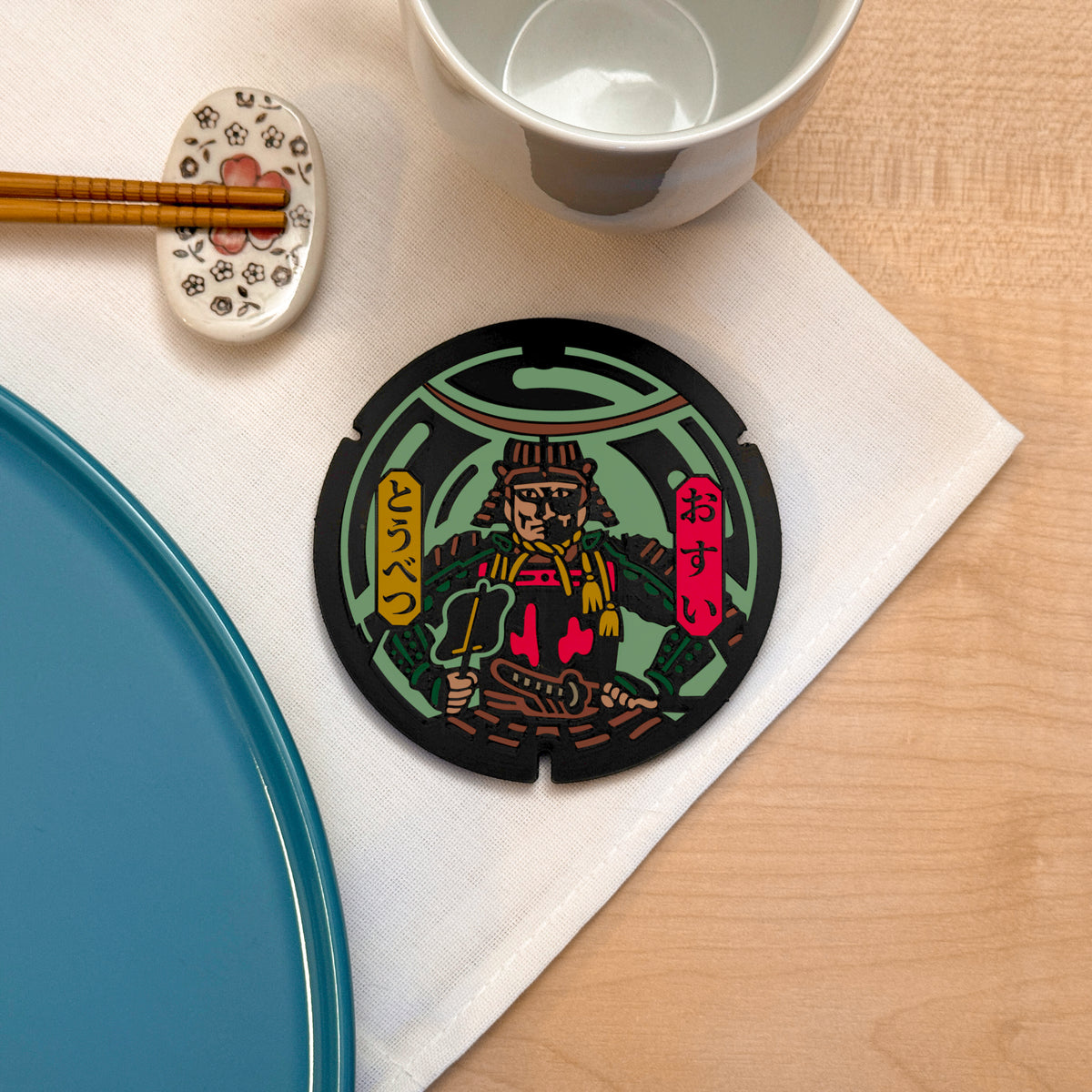 Sottobicchiere ROJI collezione Samurai con il design del tombino di Date Kuninao, Tobetsu