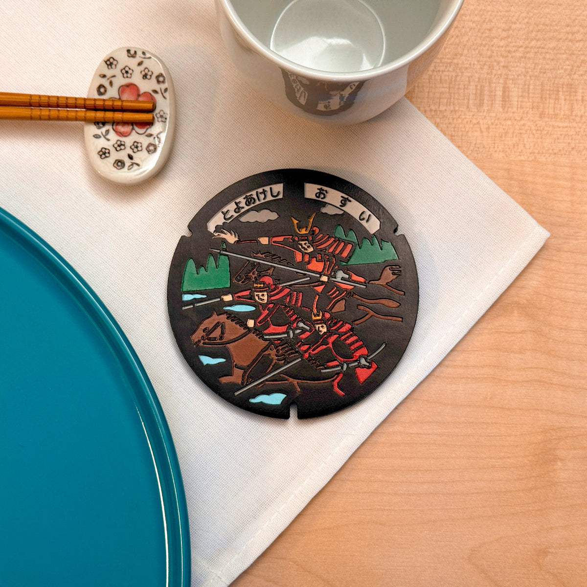 Sottobicchiere ROJI collezione Samurai con il design del tombino della battaglia di Okehazama, Toyoake